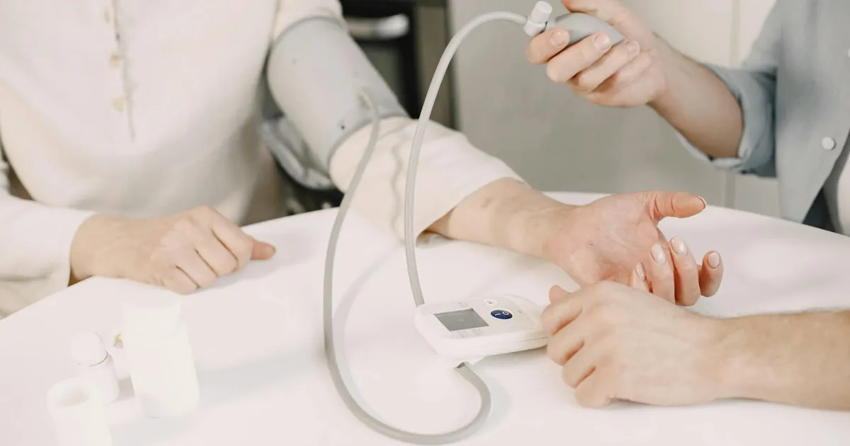 Close-up of blood pressure measurement at home highlighting healthcare equipment. Close-up of blood pressure measurement at home highlighting healthcare equipment.