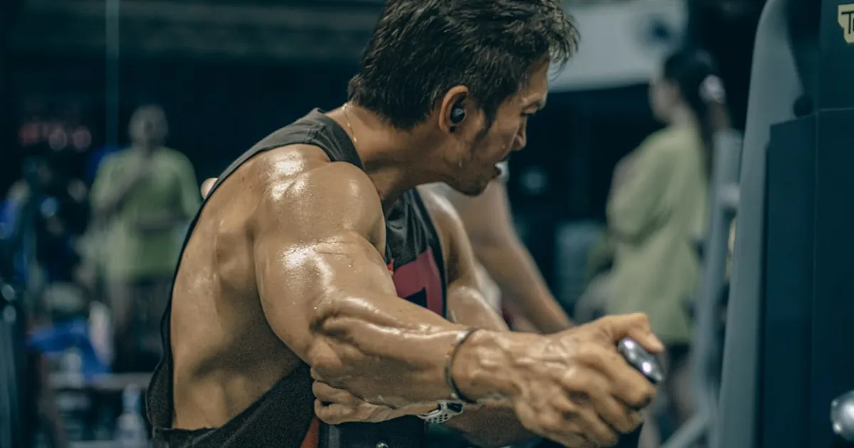 Man works out intensely in the gym.